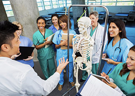 teacher with skeleton and several students