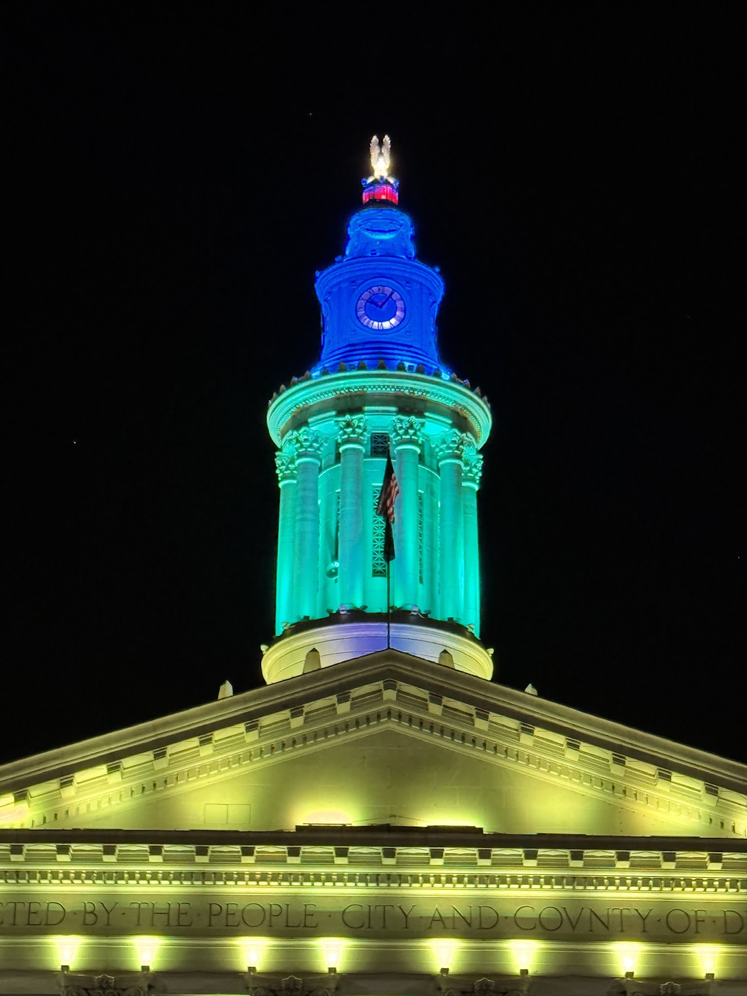 Cupola of City and County of Denver Building lit up