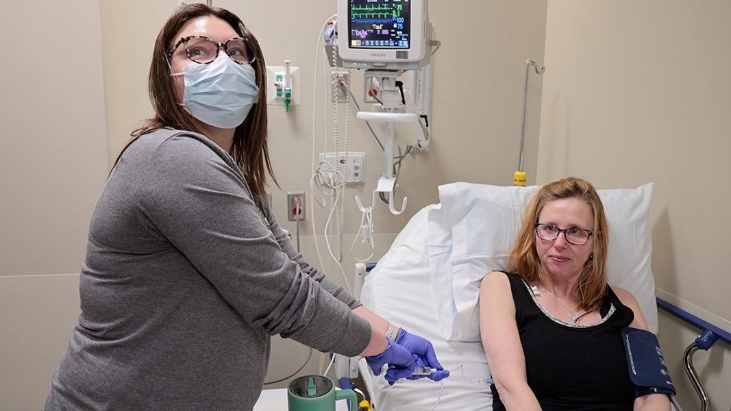 A patient receiving an infusion of CAR T cells