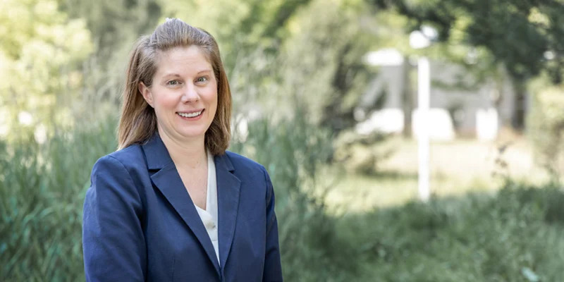 Dr. Amanda Piquet standing outdoors on the CU Anschutz Medical Campus