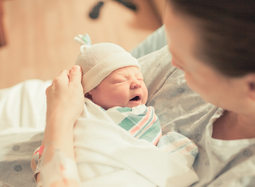 Woman with newborn in hospital