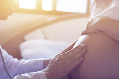 Physician with pregnant patient
