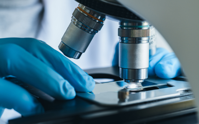 Person at a microscope