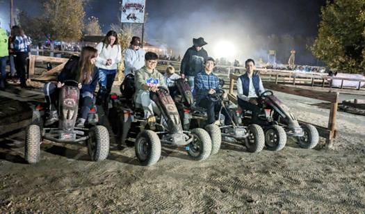 students on atvs lined up to race