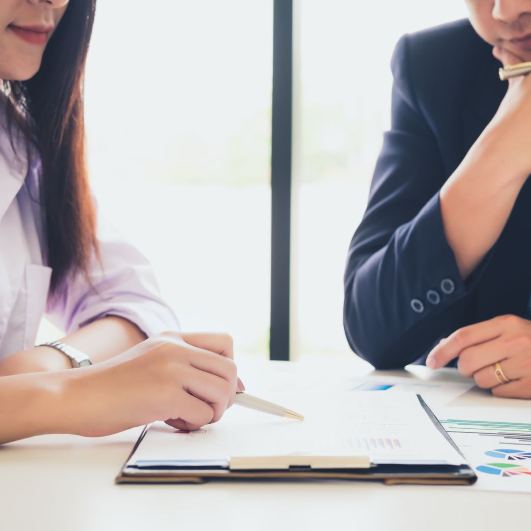 Image of two adults discussing a consult.