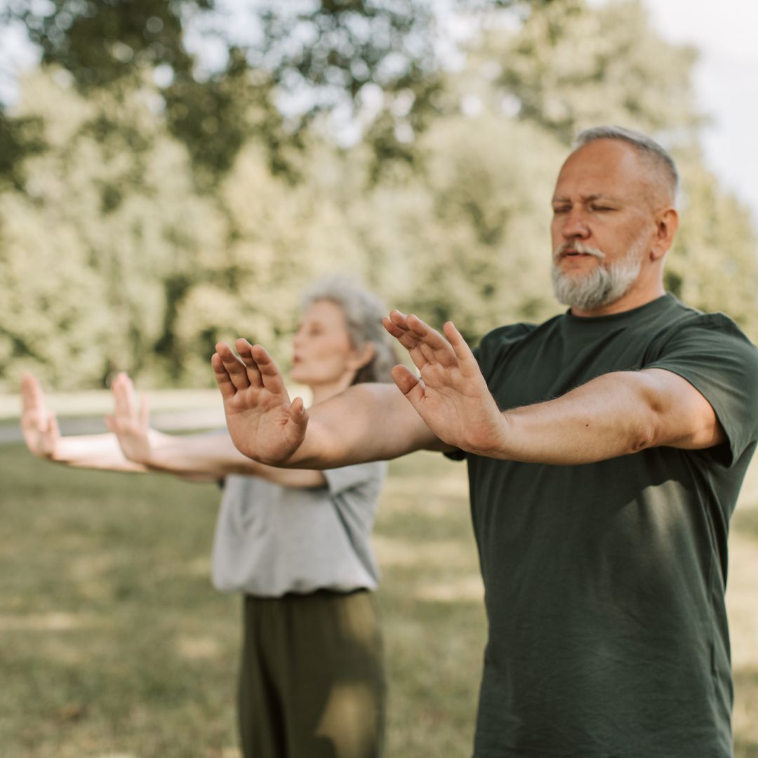 Two older adults exercising.