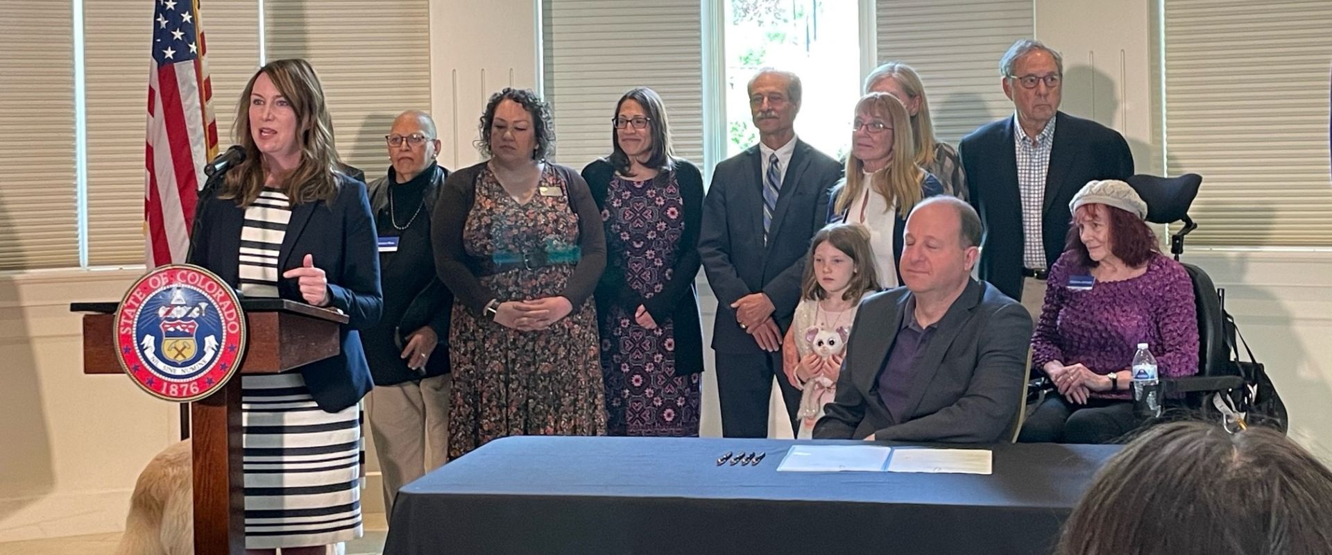 Members of the MCoA at the signing of a bill to improve healthcare access for older Coloradans.