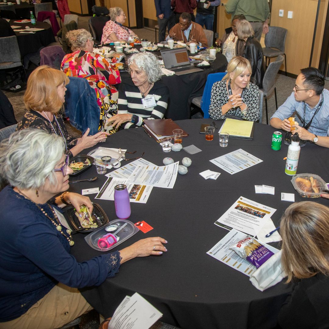 Community members and OARS talking together at the Rocky Mountain Geriatrics Conference.