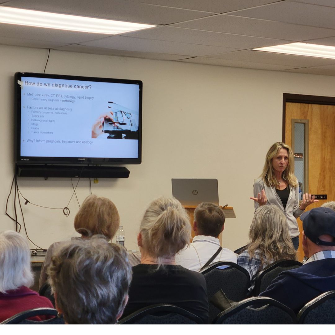 Jan Lowery giving a presentation about Cancer Center research to a group in Chaffee County.