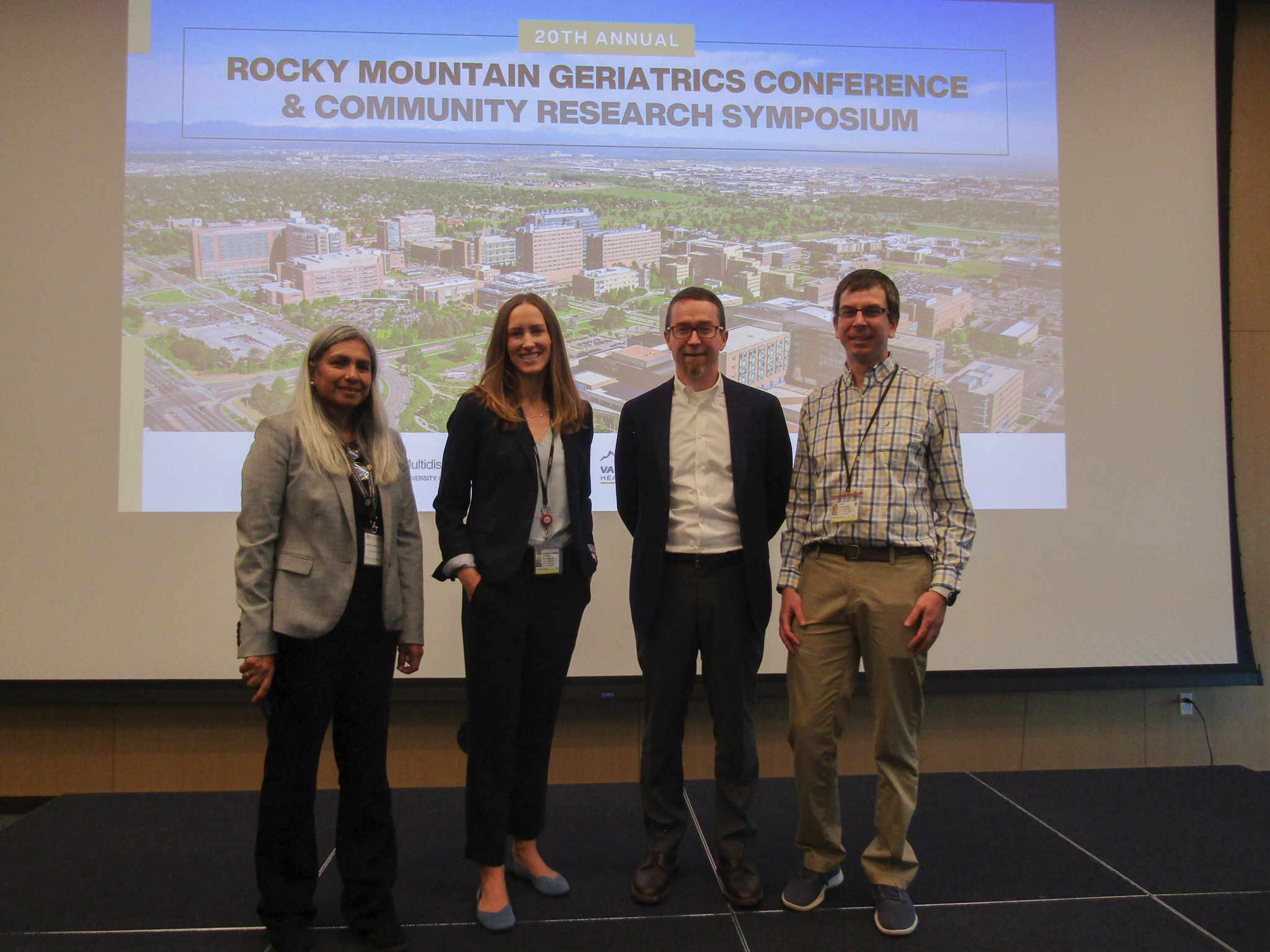 Group of presenters take the stage at the Rocky Mountain Geriatrics Conference.