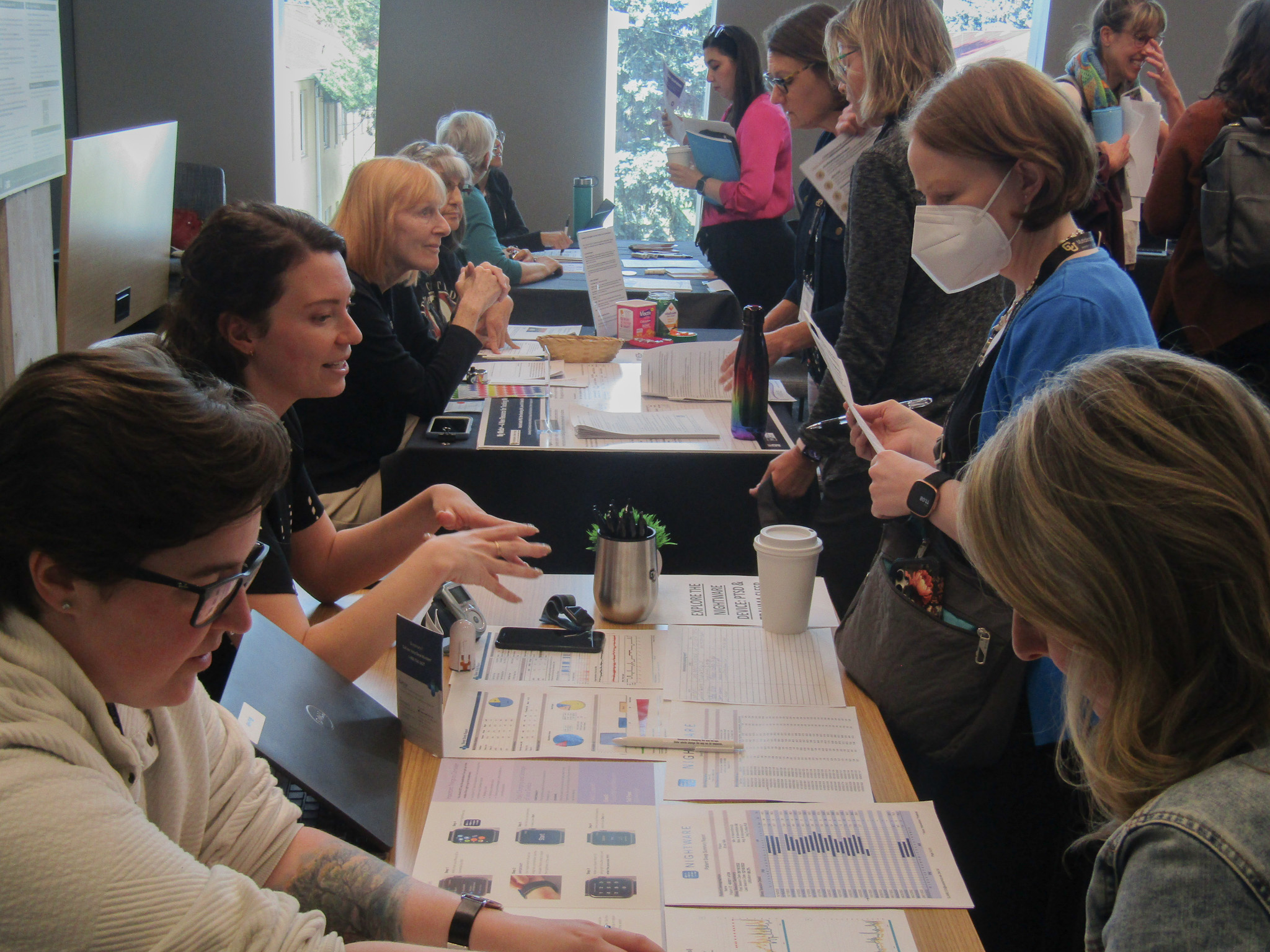 Participants at the Research Roadshow interacting with research teams.