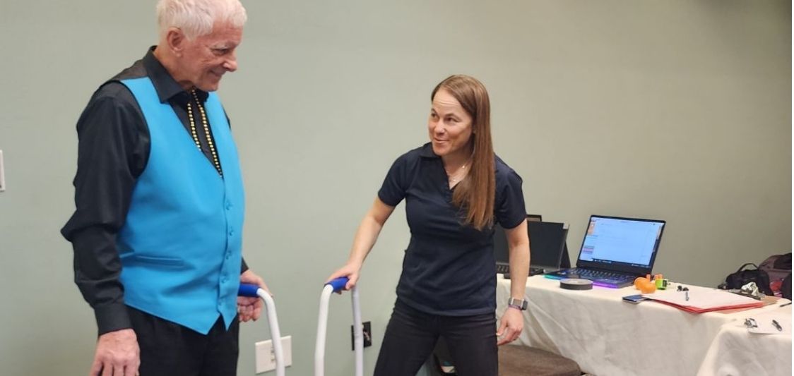 Attendee trying out an exercise program at the event.