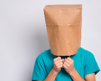 Person with a paper bag over their head
