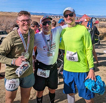 Alex Cooperwith his radiation oncologist, Timothy Waxweiler, MD  and radiation therapist Tyler Broom at the Backcountry Wilderness Half Marathon in Highlands Ranch, Colo.