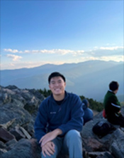 Anthony Chung with mountain backdrop