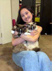 Ashley Jung holding cats