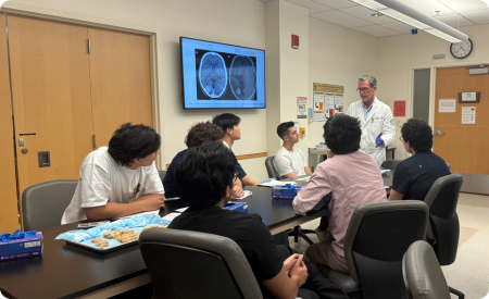 dean teaching in small classroom