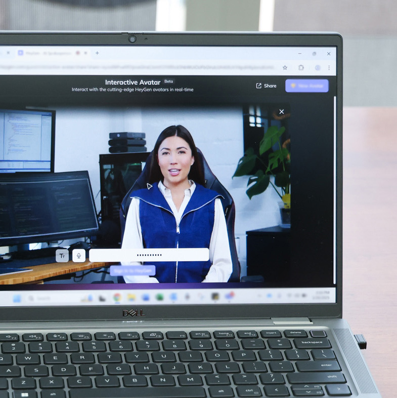 LaptopwithAIAvatarspeakingonscreen