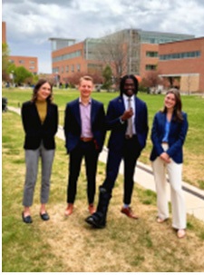 Fourpeoplestandingoncampus