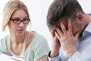 healthcareworkerwithpatientinturmoilheadinhands