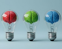 Three lightbulbs with colors brains inside them