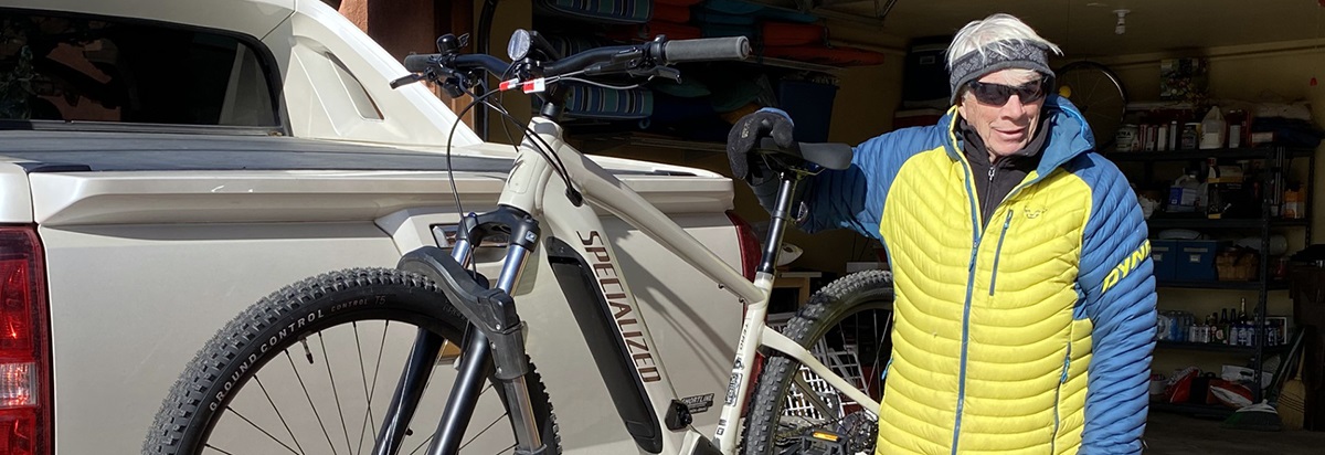 JimPagenexttohisbikeandatruckheadingoutforabikeride