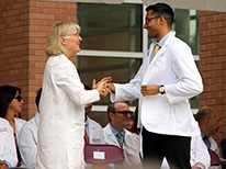 doctorandmatriculantshakinghandsonstage