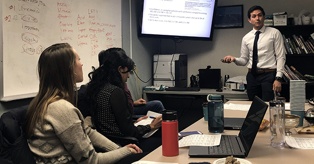 Itzam Marin leading a seminar discussion when he was a medical student 