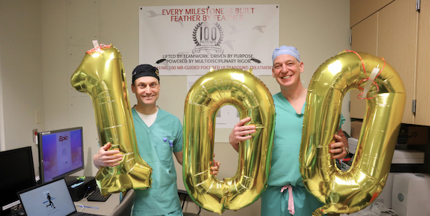 Twodoctorsholidnggoldballoonsspelling100