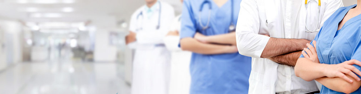 armscrossedfourhospitalworkers