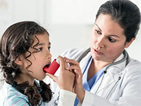 doctor giving inhaler to child