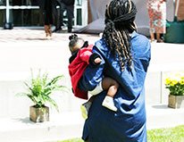 Backofmotherwithchildonhip