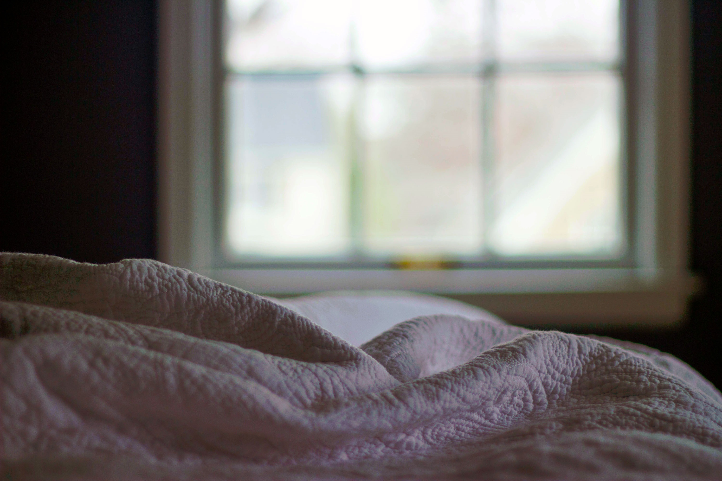 blanketonabedwithwindowinbackground