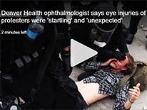 manongroundwitheyeinjuryPolicebendingoverhim