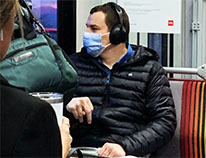 man wearing face mask on bus