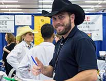 Medical student in cowboy hat in clinic