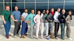 FortCollinsStudentsLinedUpOutsideBuilding