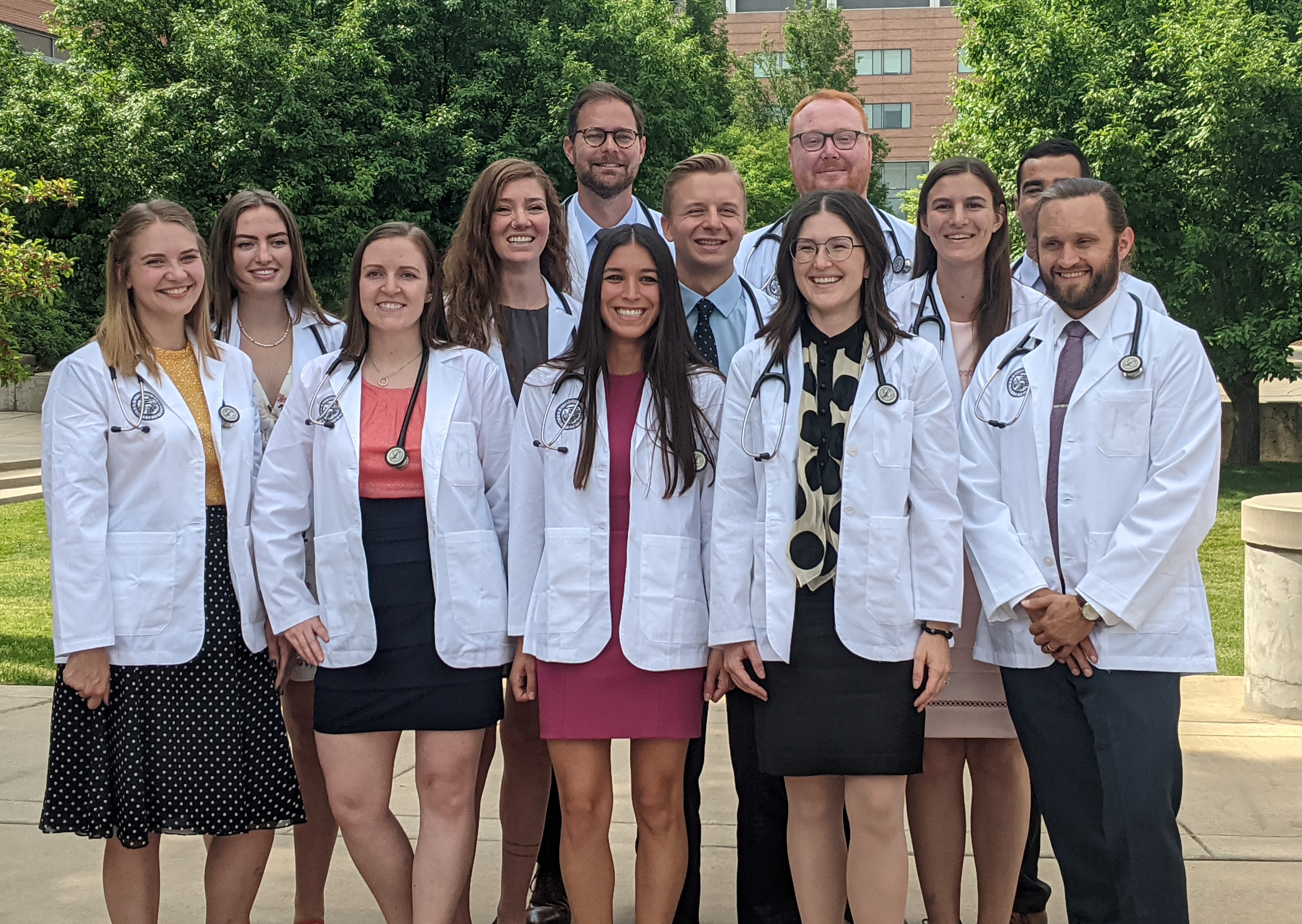 TwelvemembersofCUSchoolofMedicineClassof2025atWhiteCoatCeremony