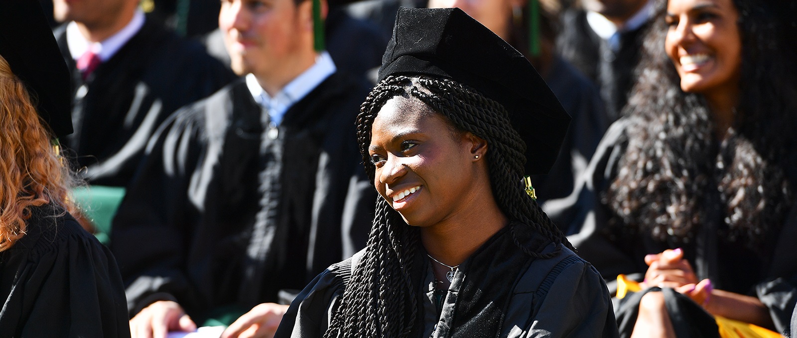 Graduateseatedandsmiling