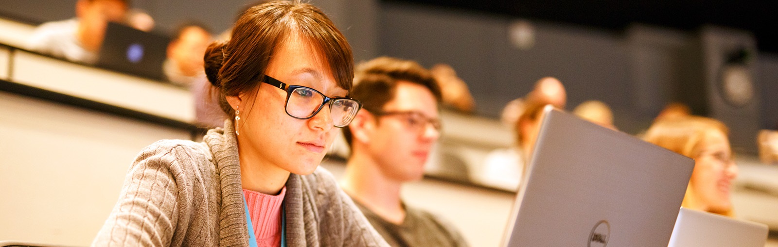 twostudentsinlecturehallwithlaptops