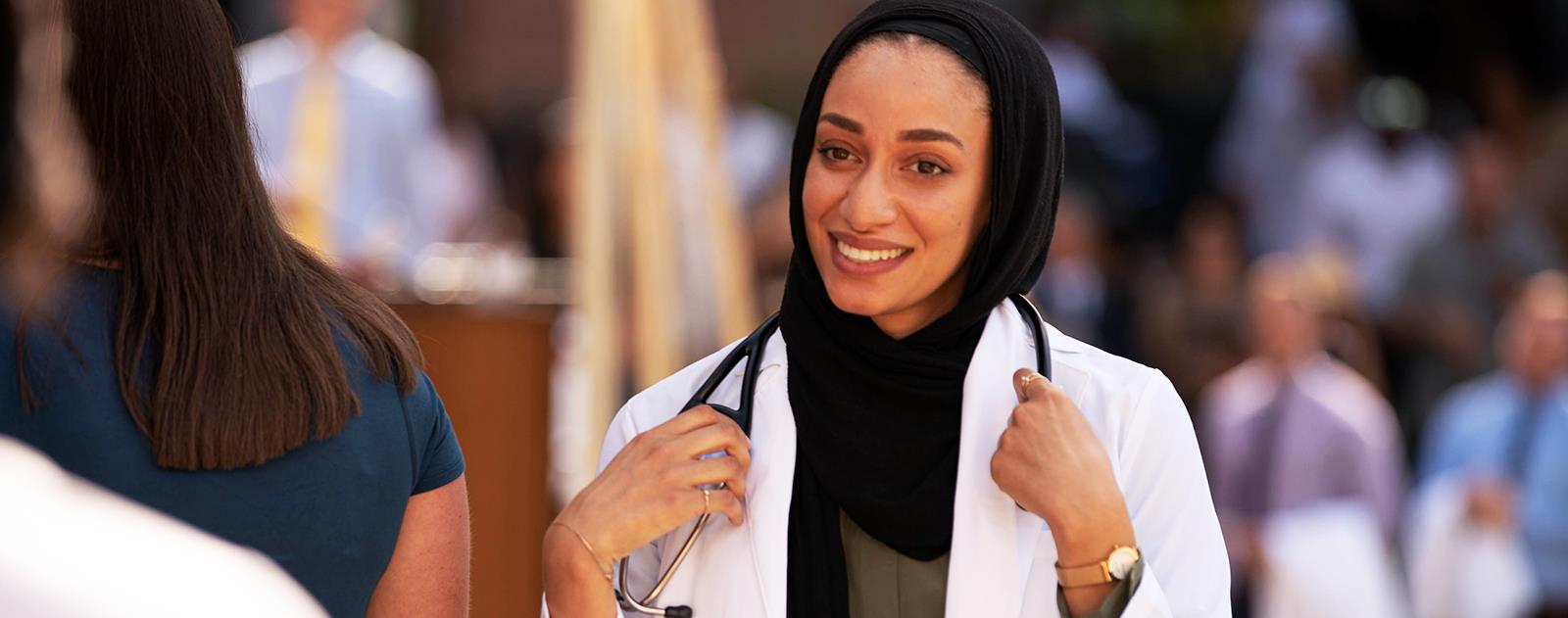 2019matriculantwearingnewwhitecoatandstethoscopewalkingacrossstage