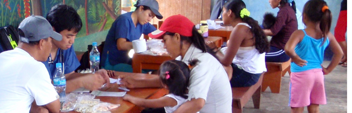 students and patients working at picnic tables