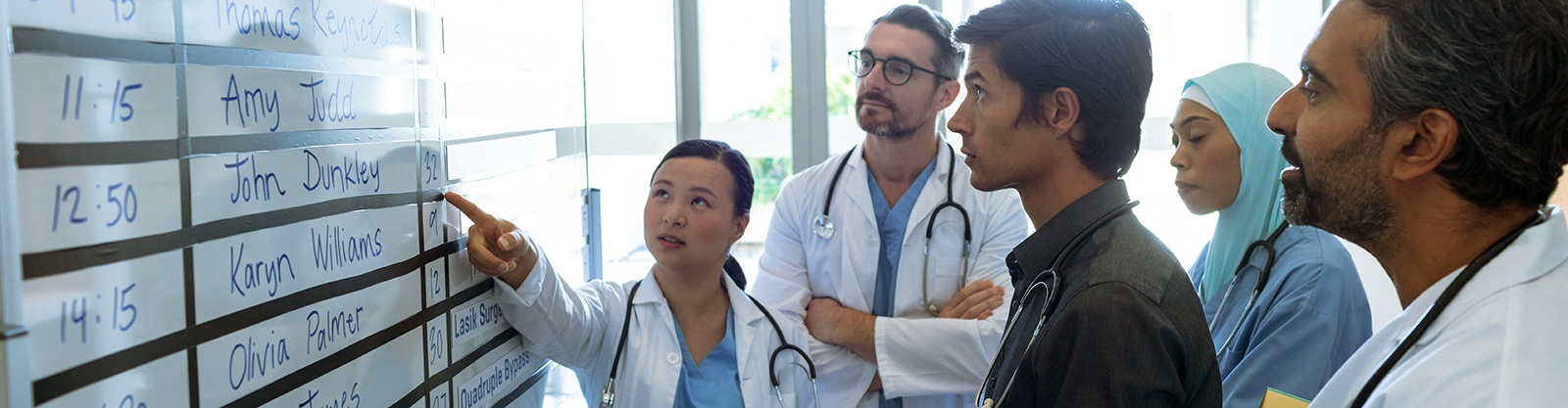 Researchersgatheredaroundwhiteboard