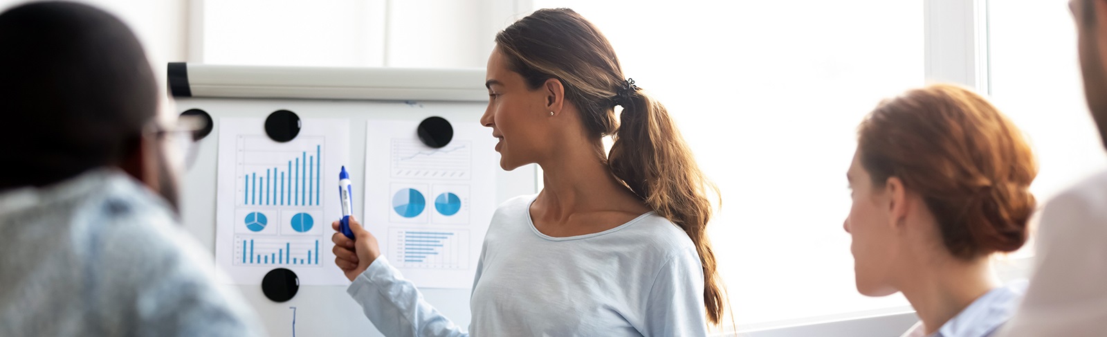 Studentatposterboardpresentingtoothers