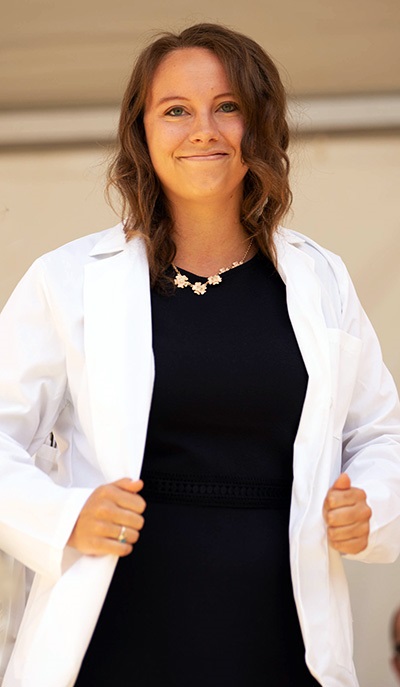 Matriculatingstudentholdingherwhitecoat