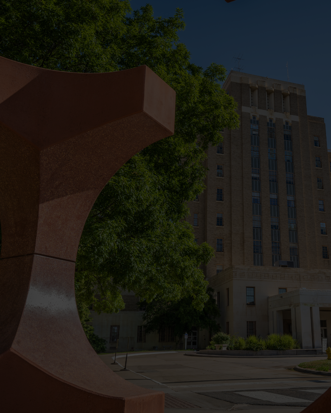 Redstonesculptureinfrontofhistorichospitalbuilding