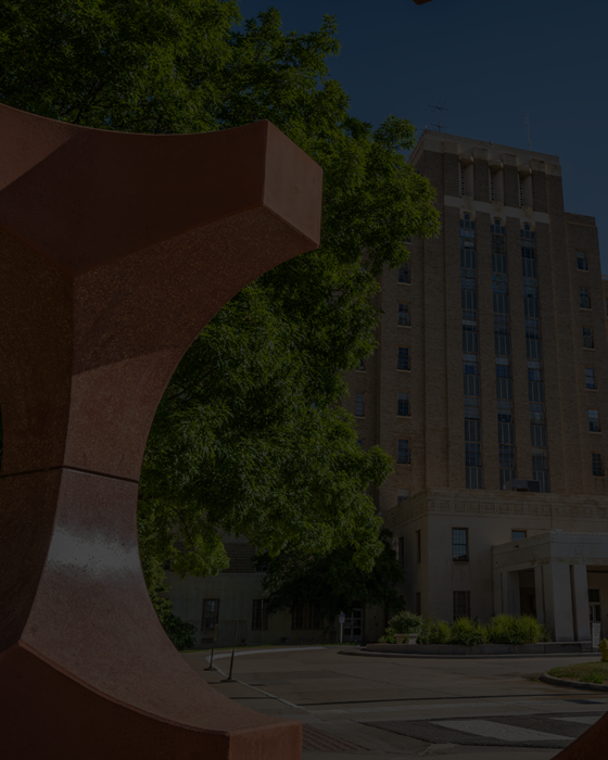 Redstonesculptureinfrontofhistorichospitalbuilding