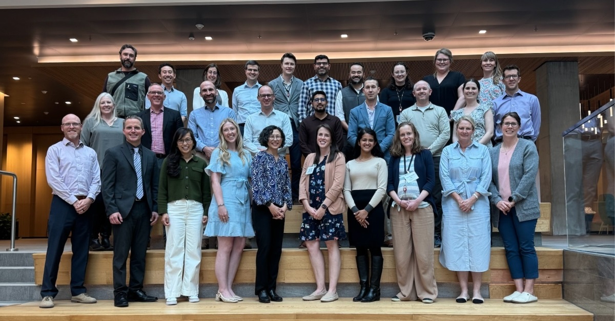 FHLparticipantsstandingonstairsandsmiling