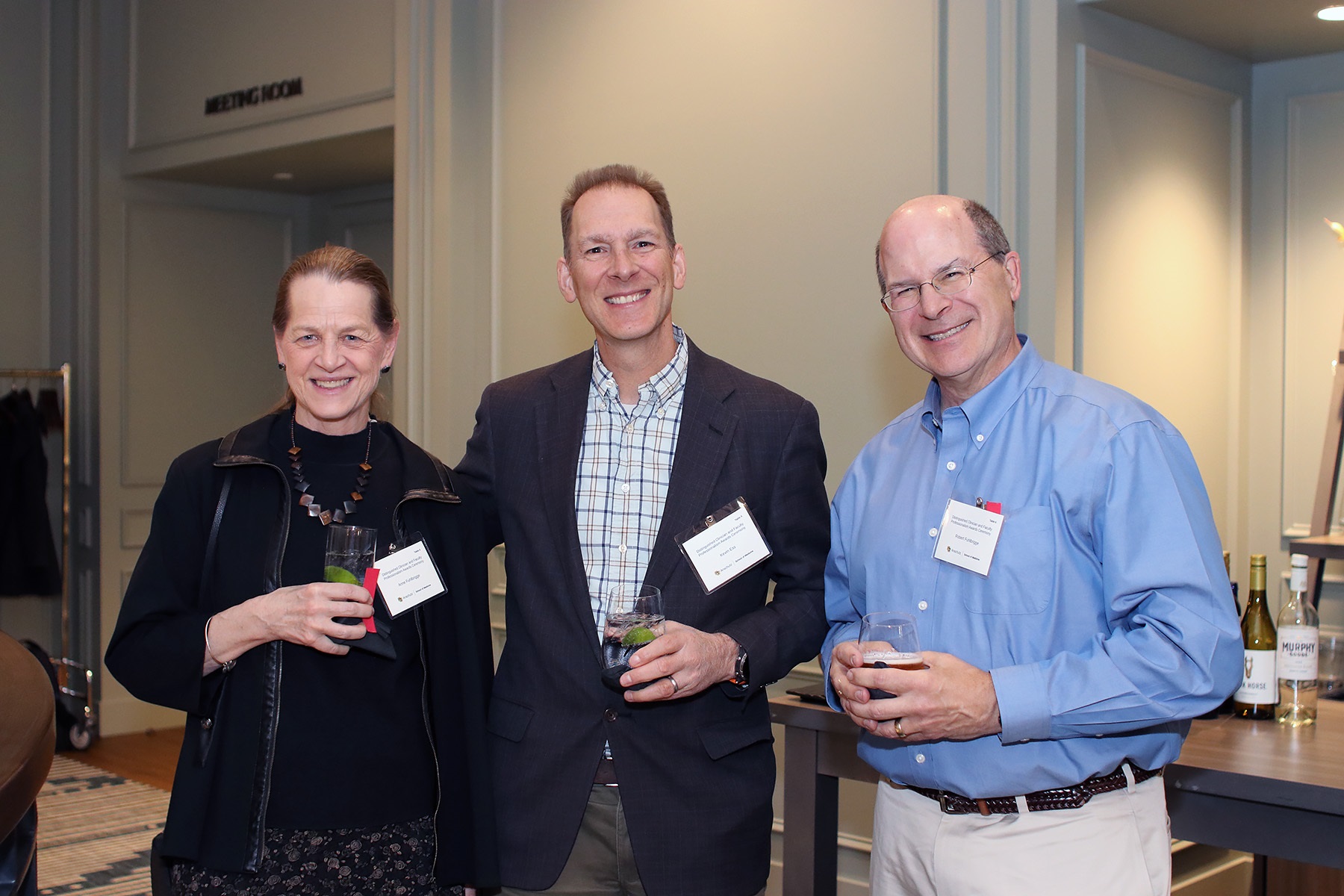 3peoplesmilingatcamera