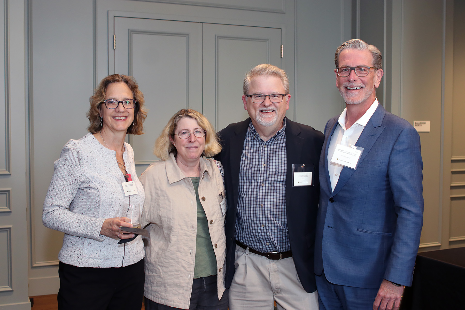 4peoplesmilingatcamera